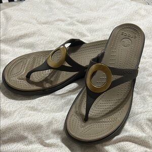 Crocs Women's Black and Tan Sandals with matte brass looking